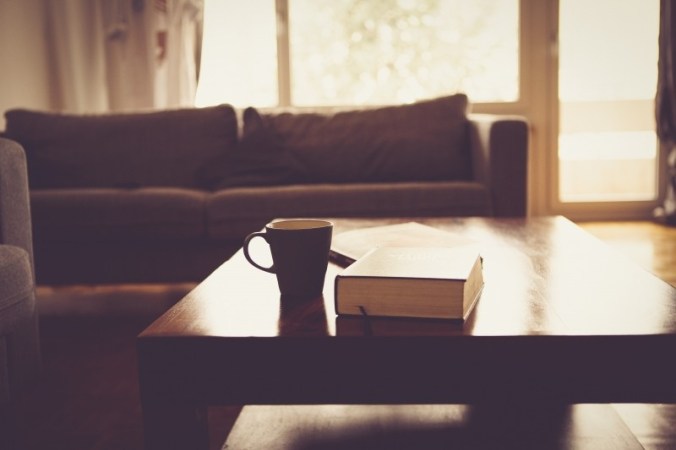 coffee-mug-and-book-on-table-in-living-room